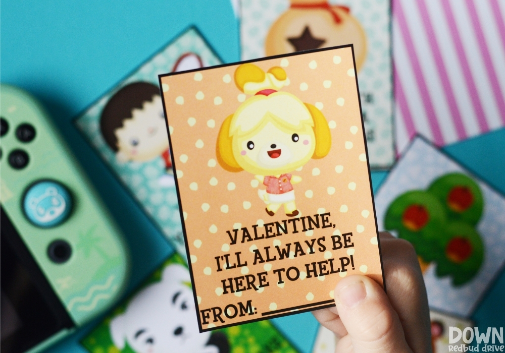 animal-crossing-valentines-wide-4 A child holding a valentine that says "Valentine, I'll always be here to help!" on it.