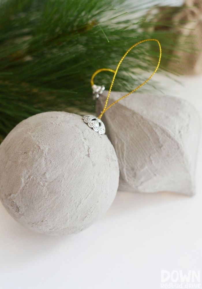 diy-concrete-christmas-ornaments-tall A tall closeup of the finished DIY Concrete Christmas Ornaments.