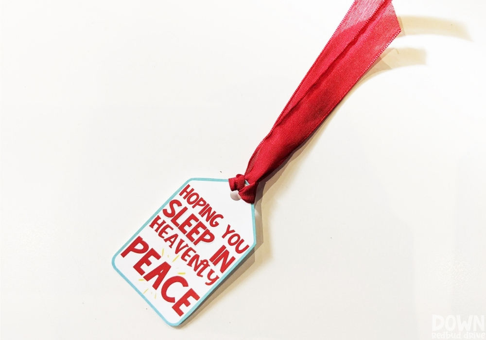 diy-sleep-in-heavenly-peace-gift-drd-wide-2 Overhead view of a Christmas gift tag that says, "Hoping You Sleep In Heavenly Peace".