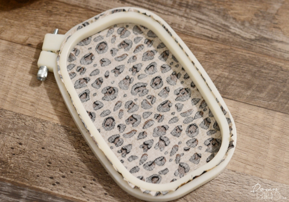 embroidery-hoop-pumpkins-2 leopard print fabric in a small rectange shaped embroidery hoop