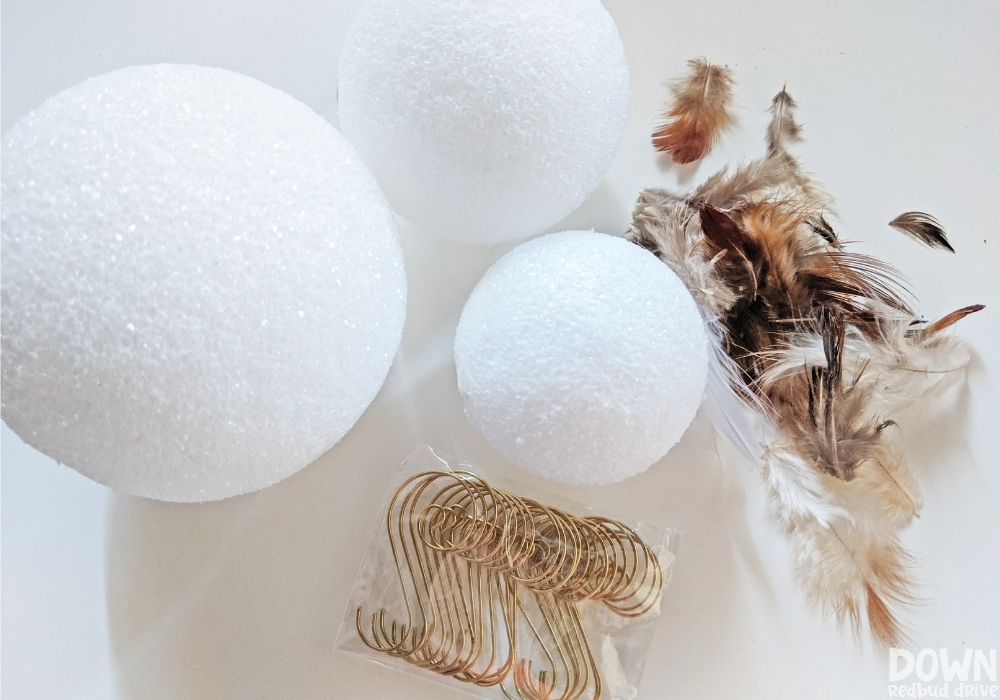 feather-ornament-diy-wide-1 Overhead shot of the supplies for the Feather Ornament DIY.