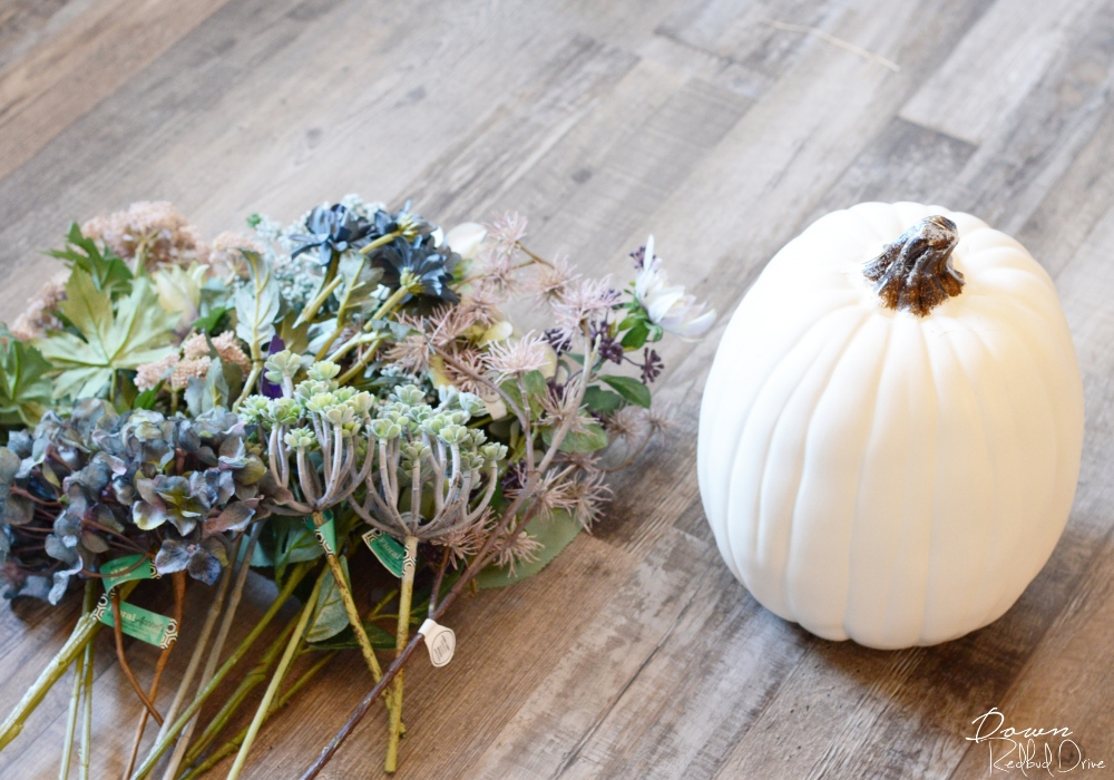floral-pumpkin-1 fake floral with a white pumpkin on a wooden floor