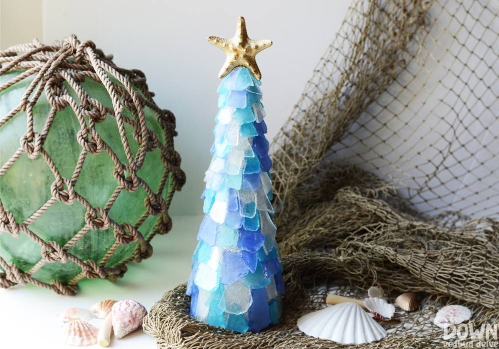 sea-glass-christmas-tree-diy-wide-4 Wide picture of the finished Sea Glass Christmas Tree surrounded by nautical themed items.