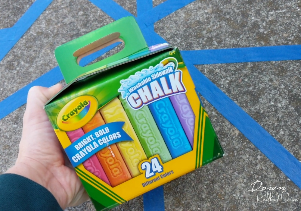 sidewalk-chalk-mosaic-1 crayola sidewalk chalk with blue painter's tape on the concrete sidewalk behind it
