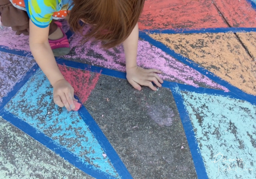 sidewalk-chalk-mosaic-4 girl coloring a sidewalk chalk mosaic