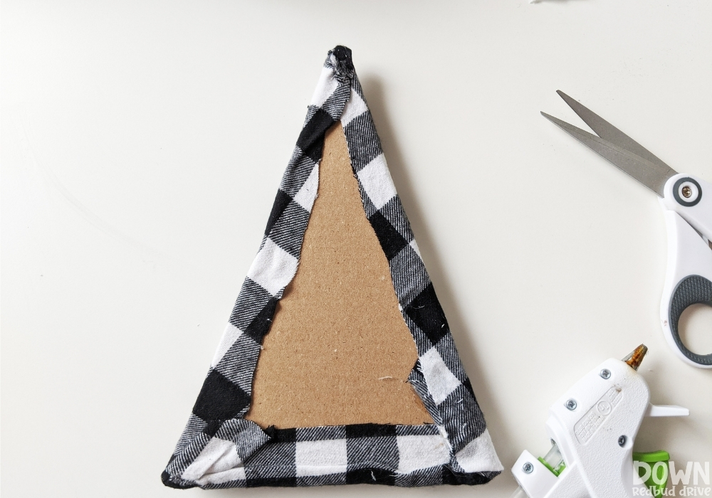 wood-and-fabric-christmas-tree-diy-wide-7 The buffalo check fabric glued onto the triangular cardboard and quilt batting.